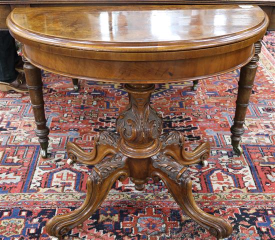 A Victorian walnut card table, W.93cm